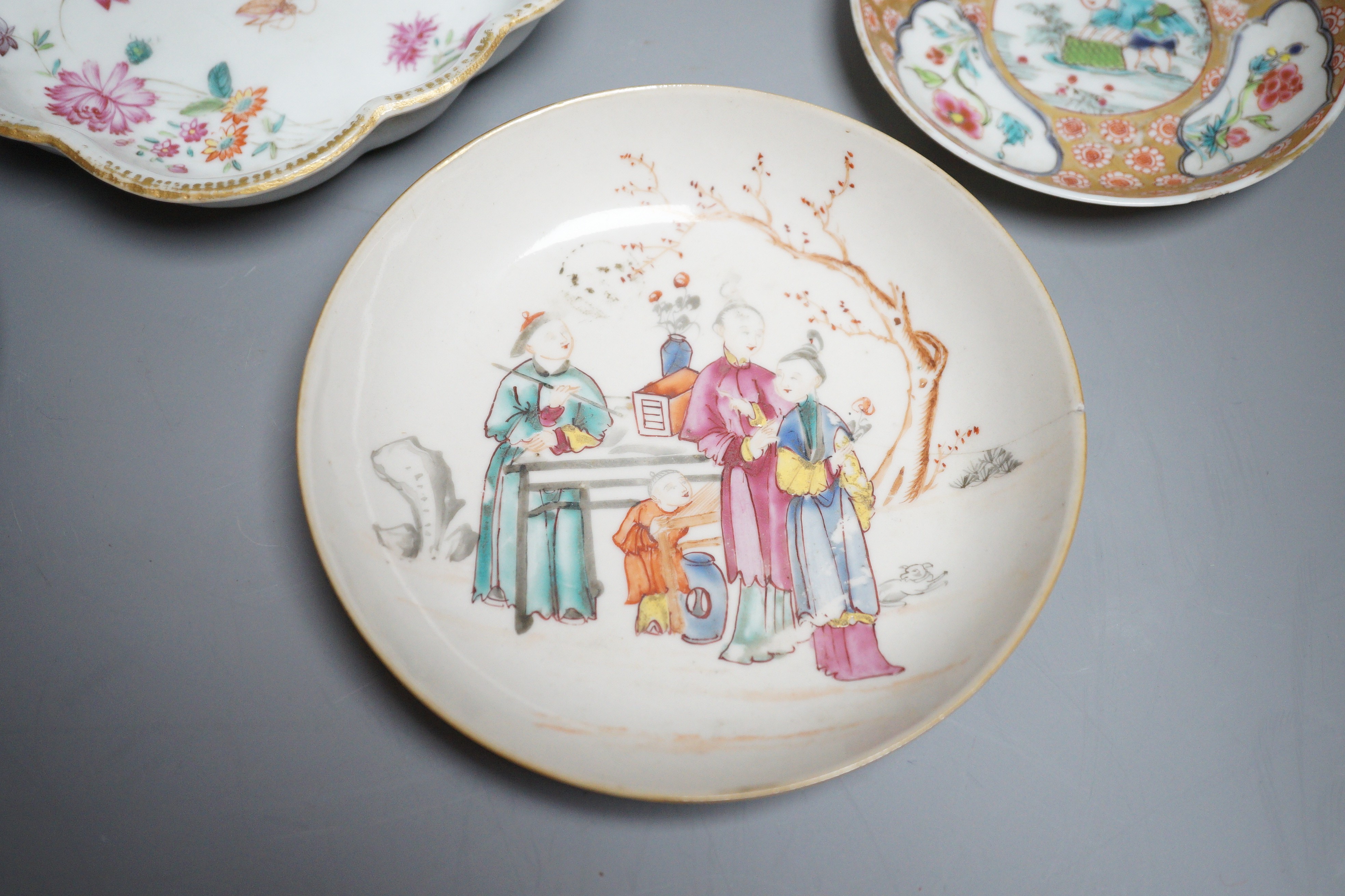 Two 18th century Chinese export saucers and two other later dishes, largest 13cm diameter